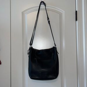 The Sak black leather medium crossbody or shoulder handbag.